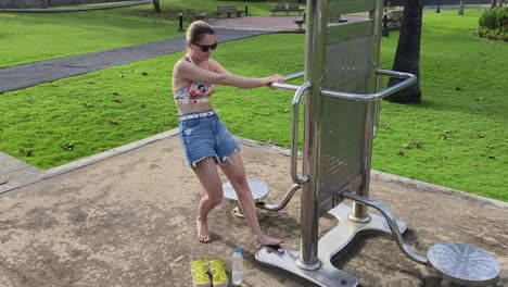 woman stretching at outdoor gym