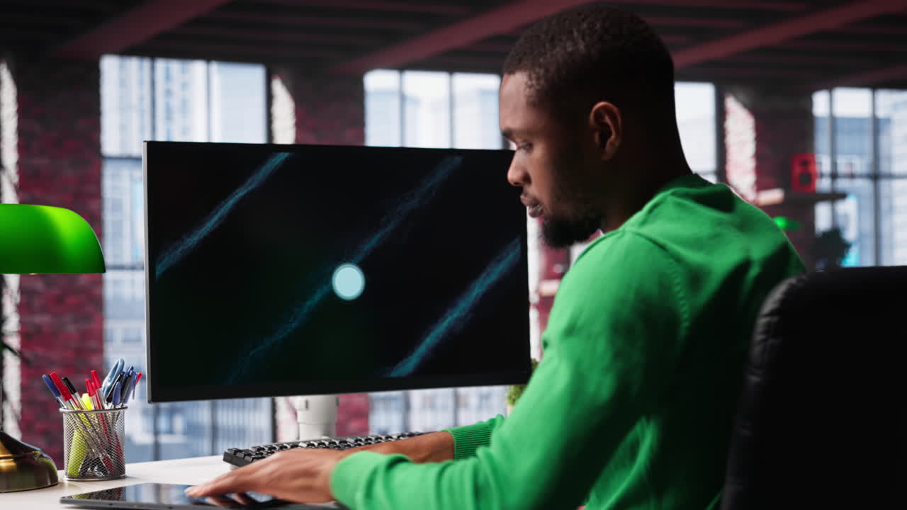 Vertical Video Black freelancer at home watching business conference on PC monitor