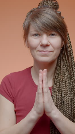 woman with braids in red shirt