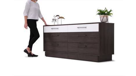 a stop motion video of a young woman model demonstrating the drawer feature on a expresso color wooden furniture bedroom dresser with pressure fit hinges against a white background with shadow