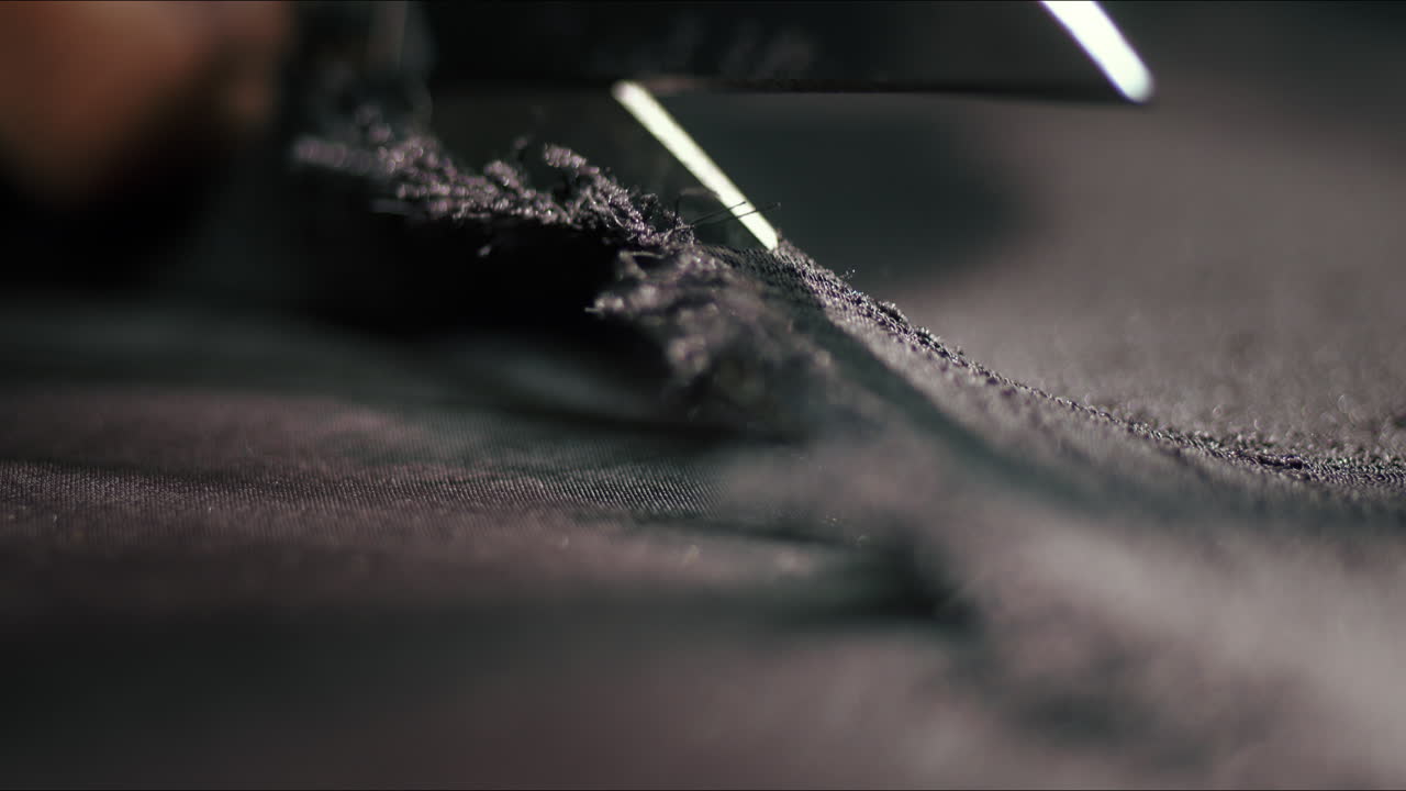 Macro shot of cutting fabric