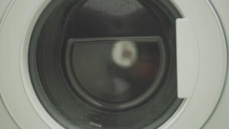 front-loader washing machine with laundry inside