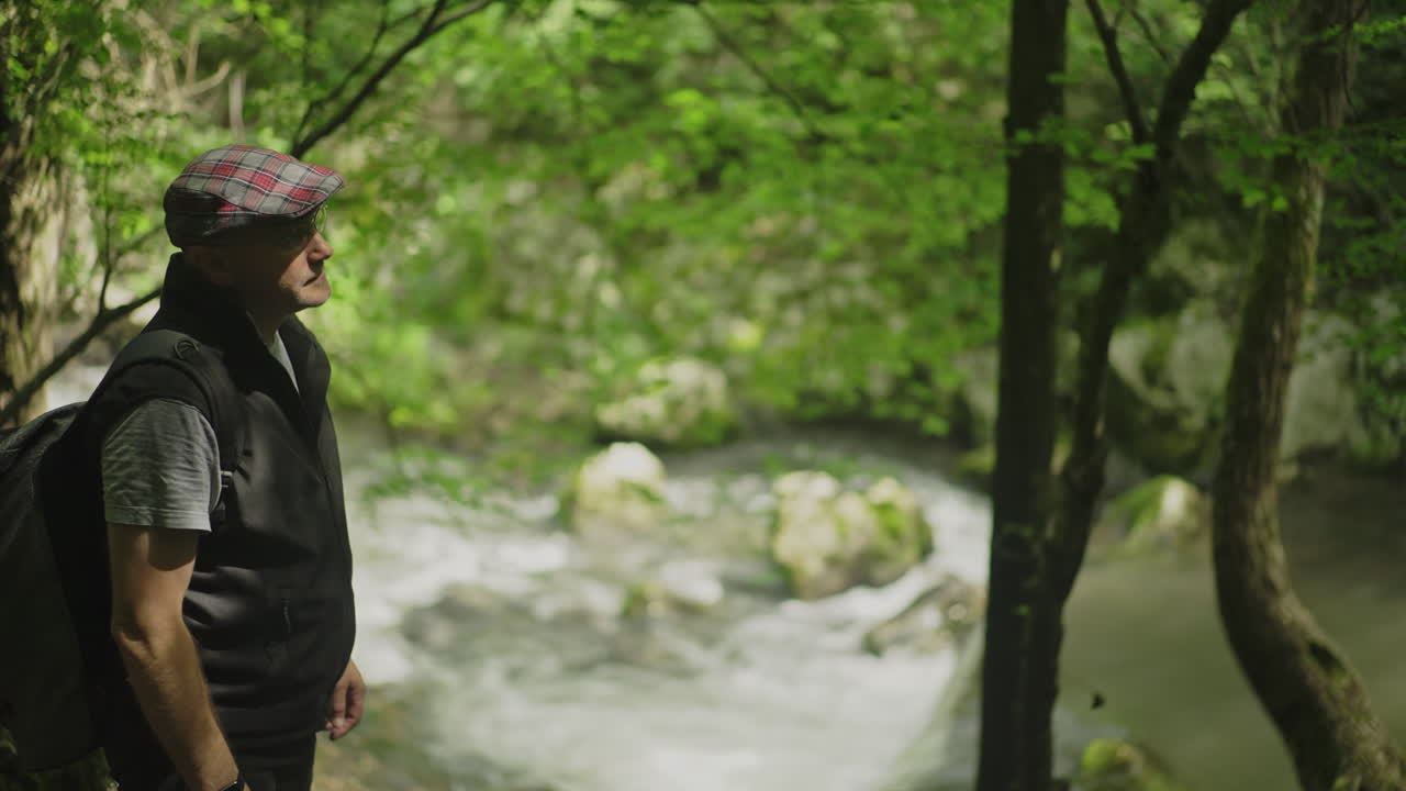 Man in Nature by a River