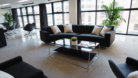 modern office lounge area with sofa and coffee table