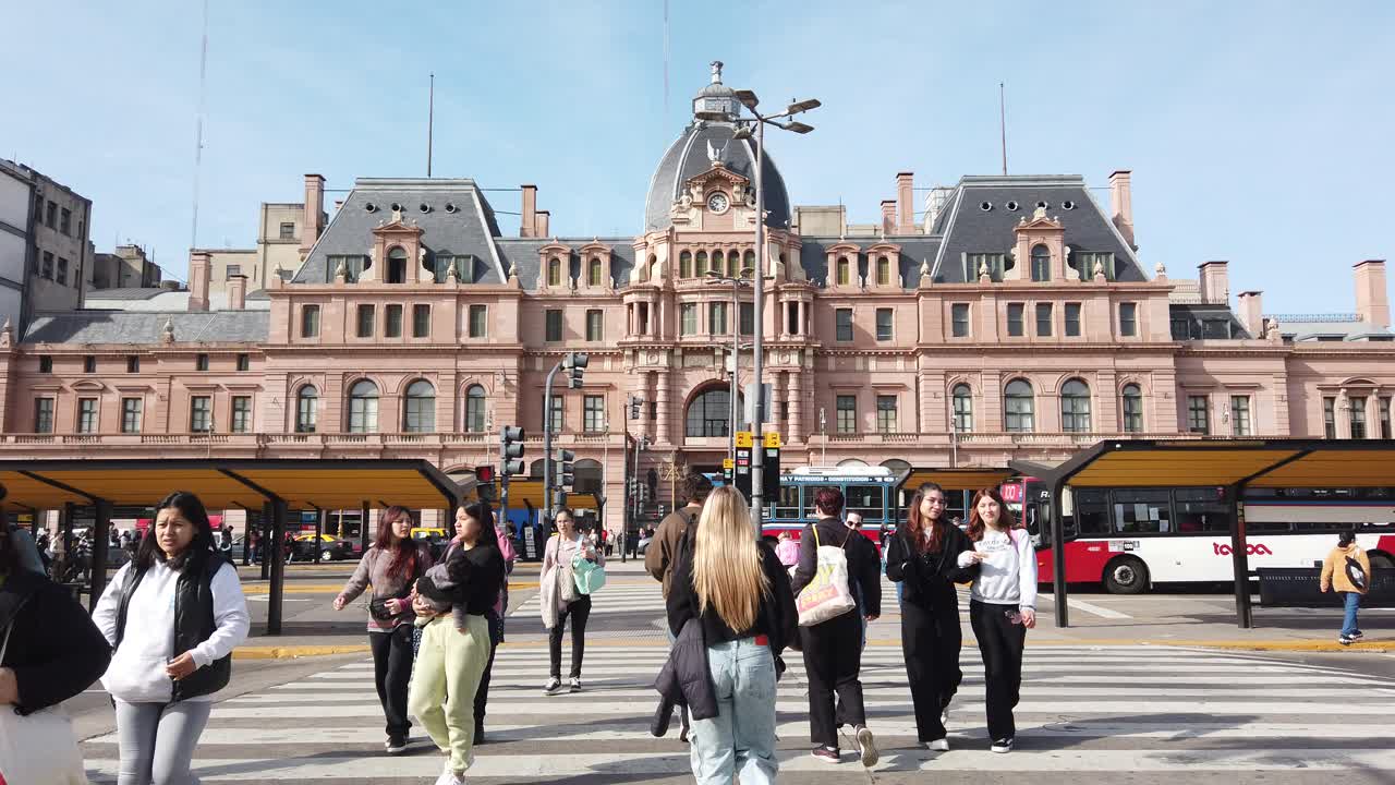 Local Argentine women walk at constitucion railway plaza station of Buenos Aires city daylight