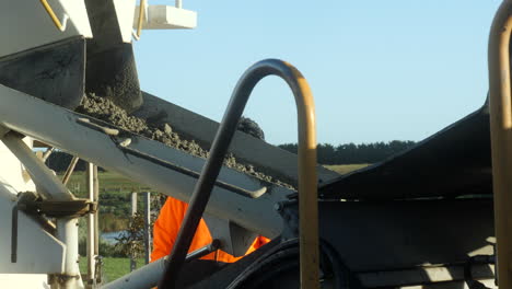 wet cement transferring from truck to pump on site at new slab build