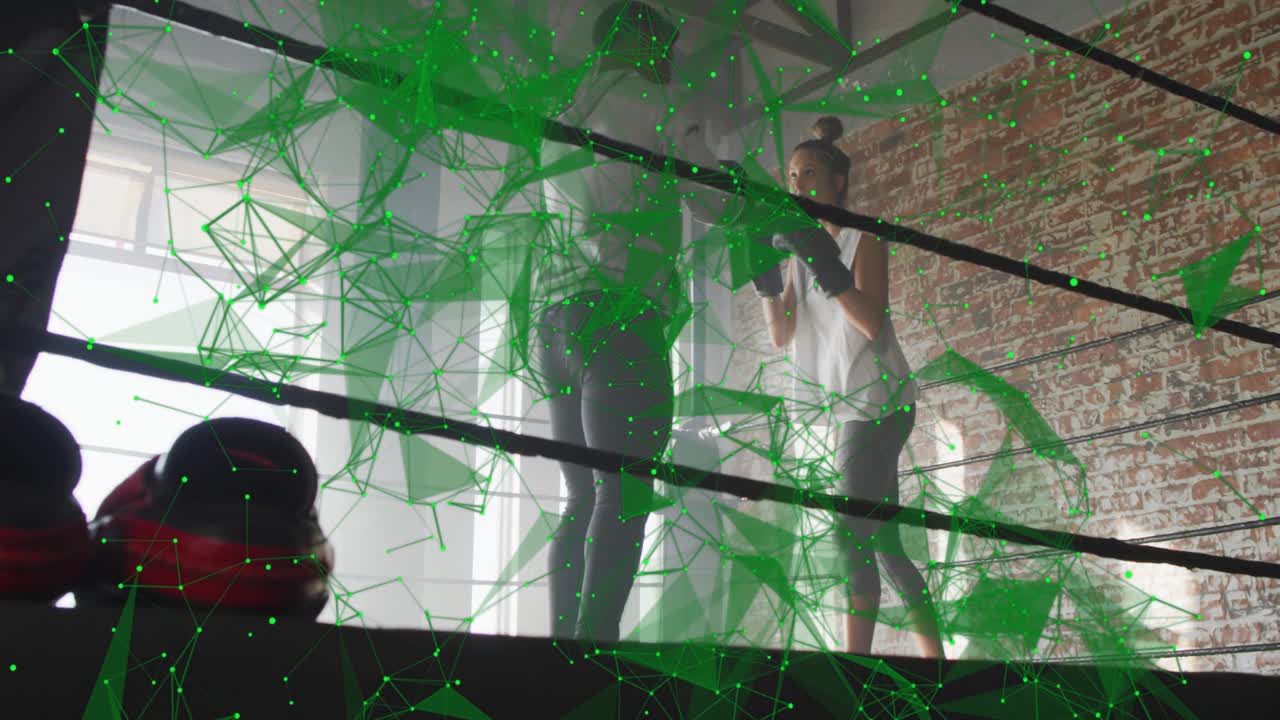 Boxer throwing jabs at partner holding pads during training, green net overlay showing footwork