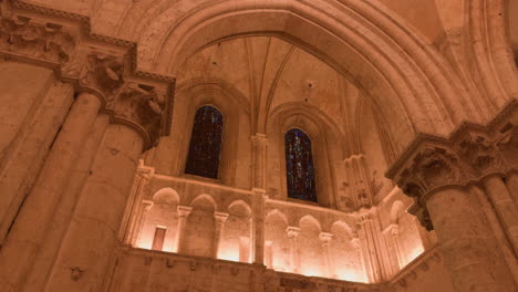 a stunning view of gothic arches and stained glass in saint-nicolas church, blois