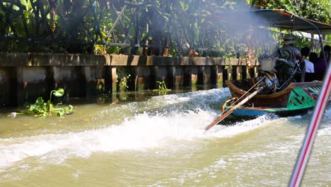 a boat speeds through a bustling floating market