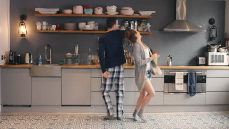 couple dancing in the kitchen