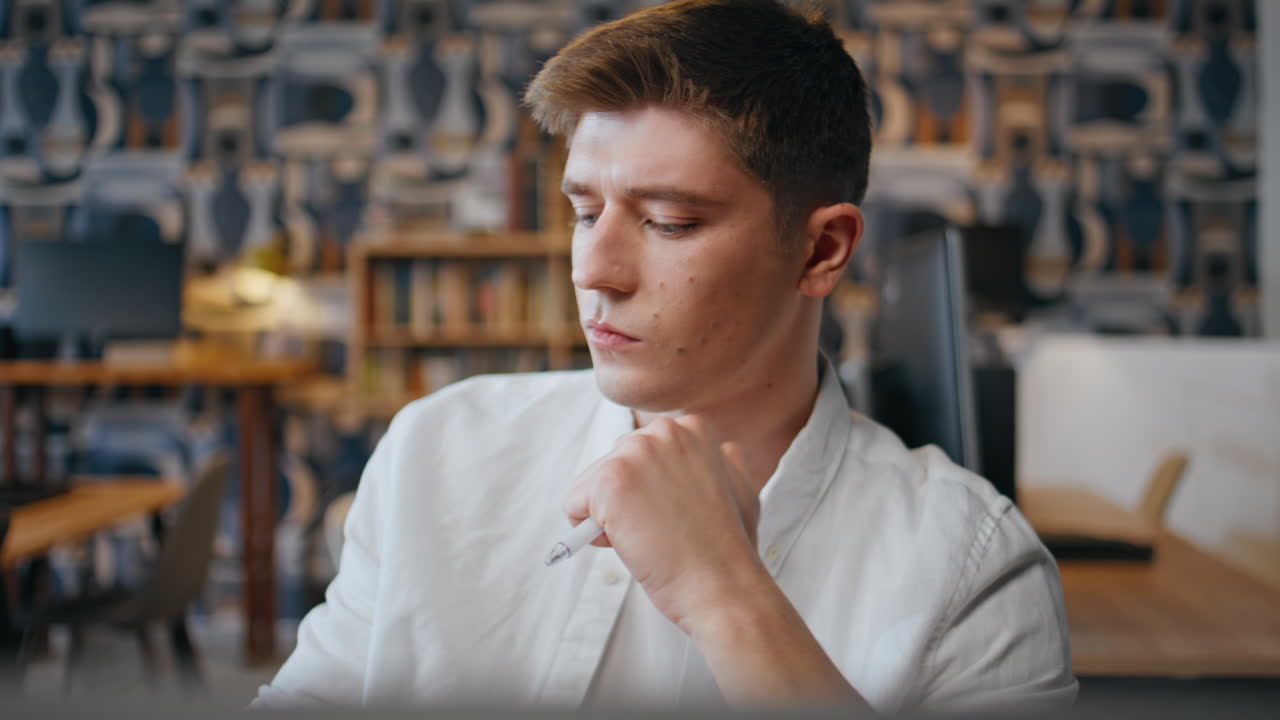 Pondering employee thinking ideas working in office closeup. Manager holding pen