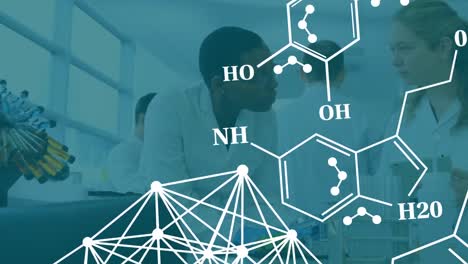 Animation-Chemischer-Strukturen-Im-Vergleich-Zu-Zwei-Verschiedenen-Wissenschaftlern,-Die-Im-Labor-Diskutieren