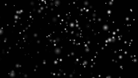 bouncing white balls against black background
