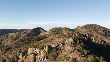 Aerial-drone-dolly-above-hikers-on-lost-mine-trail-in-desert-sandstone-hike