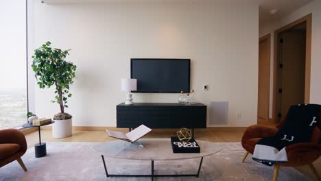 wide shot of a modern living room with a blank television