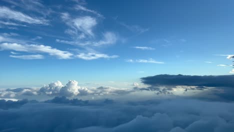 Breathtaking-view-from-a-jet-cockpit-overflying-a-turbulent-sky-just-before-sunset