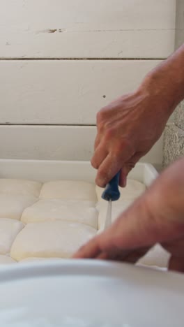 chef preparing the pizza dough in restaurant kitchen