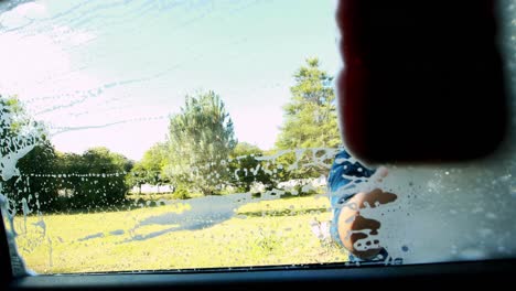 boy washing a car 4k