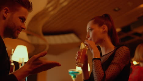 playful couple dancing in restaurant. man and woman spending time in bar