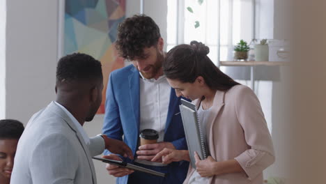 group-of-business-people-using-digital-tablet-computer-browsing-information-on-screen-brainstorming-ideas-in-office-meeting