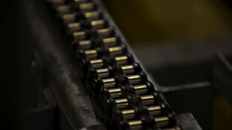 close-up of a machine chain conveyor with selective focus, industrial setting