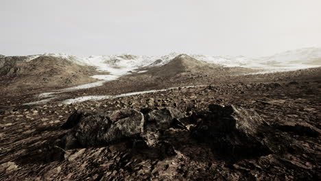 sunrise in a rocky desert with shadows cast by the hills