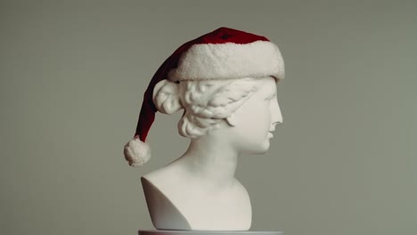 santa hat on a classical bust
