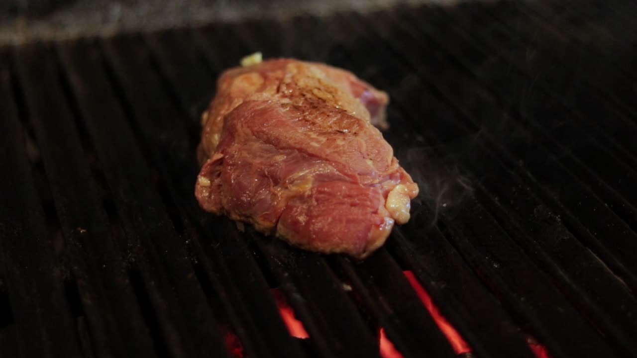 Meat grilling on a barbecue