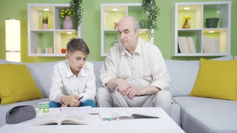 Dede-is-trying-to-solve-the-question-with-his-grandson.