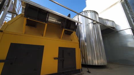 industry outdoors. small industrial building on a factory. exterior of modern grain processing plant at sunny daytime.