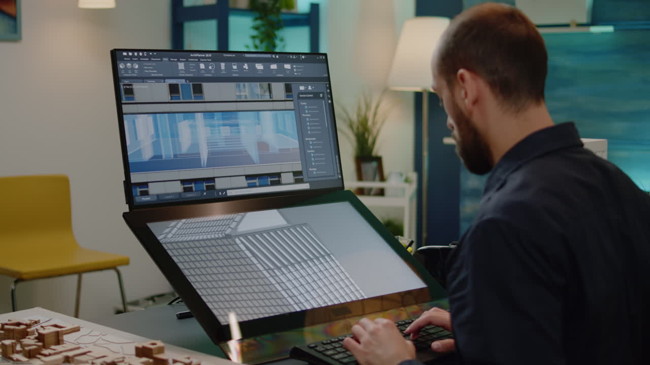 Young architect designing construction layout for building