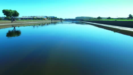 canal with bridge and cityscape