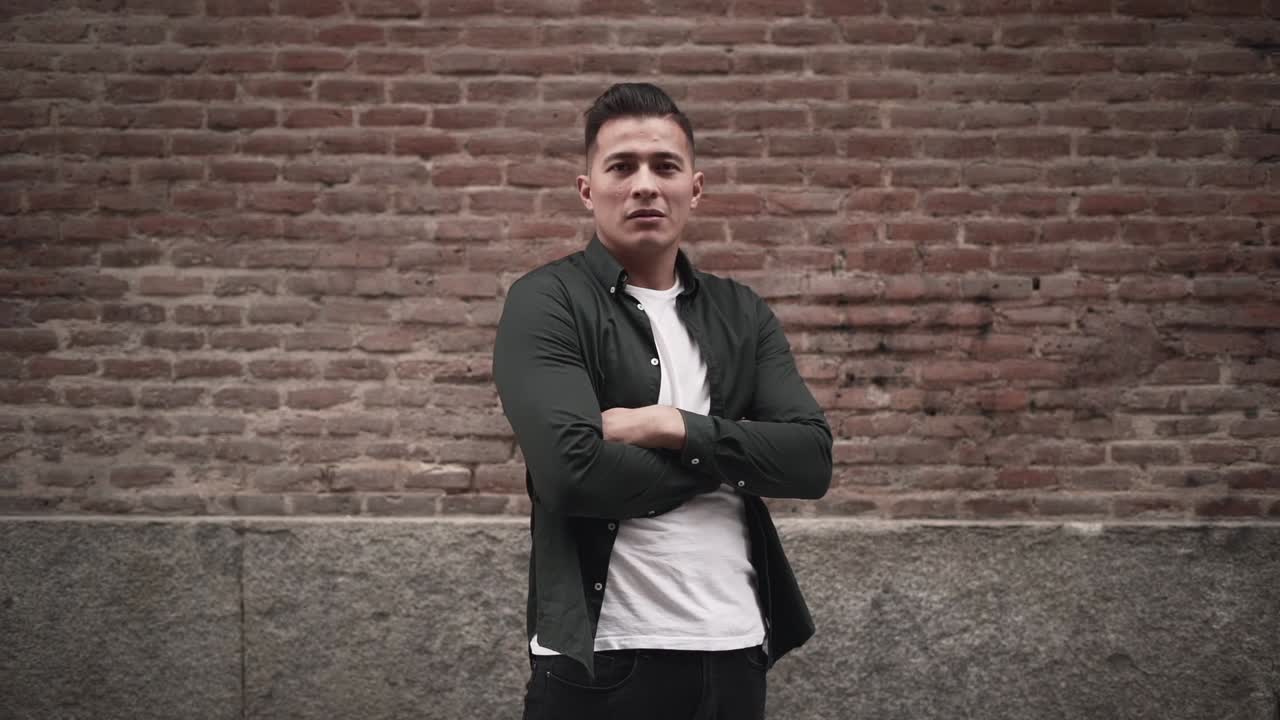 Stylish Man in Front of Brick Wall