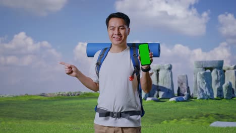 tourist with backpack and green screen smartphone
