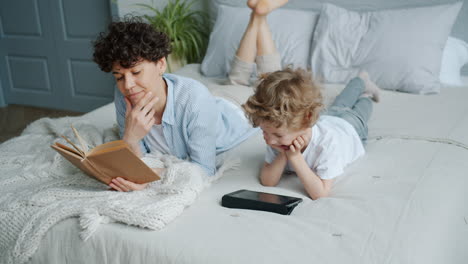 mother and child relaxing in bed