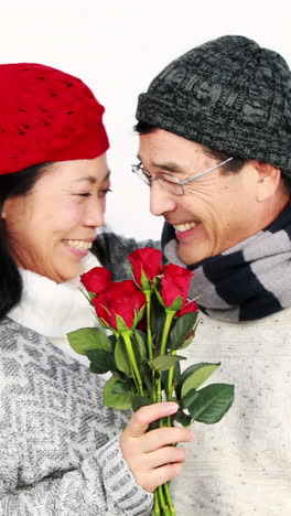 asian man giving roses to his wife