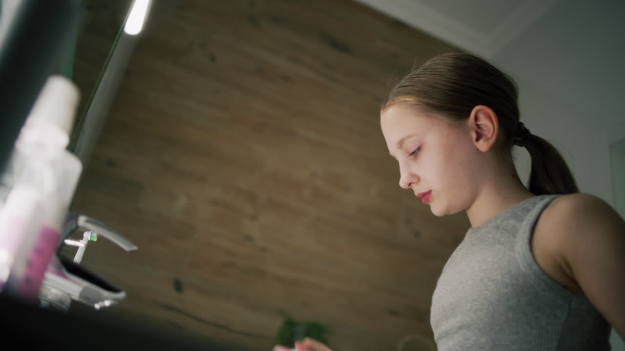 Teenage Girl in Bathroom
