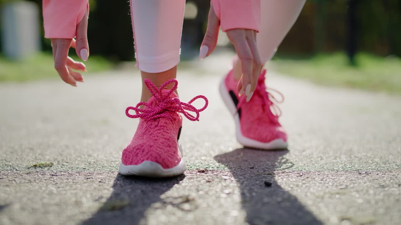 Handheld view of woman&rsquo;s legs during jogging