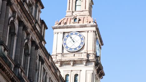 historic clock tower in bustling melbourne street