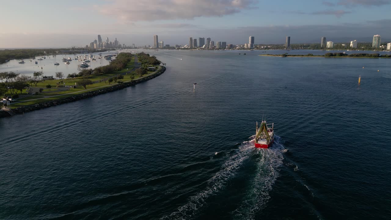 Aerial views over The Spit and seaway on the northern end of the Gold Coast in the morning on a sunny day.