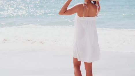 woman standing on the sand