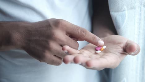 person holding pills