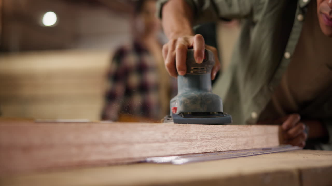 Sanding wood with an orbital sander