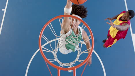 african american basketball player scores a basket