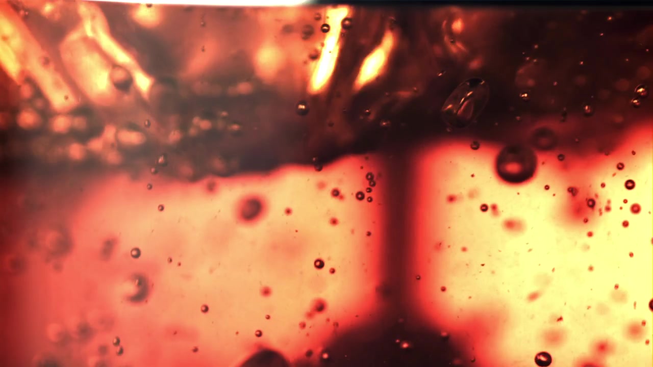Close-up of Tea Leaves Steeping in Hot Water with Bubbles