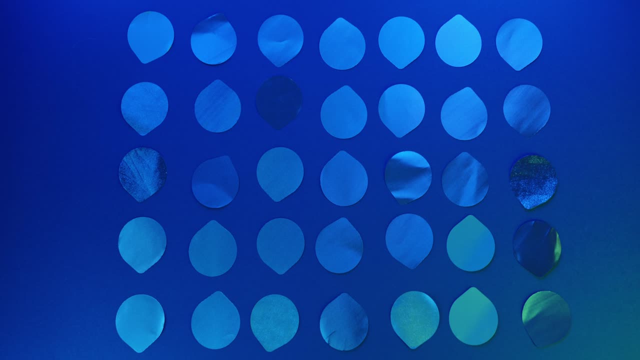 Aluminum lids on the colorful background lit with the RGB changing spectrum