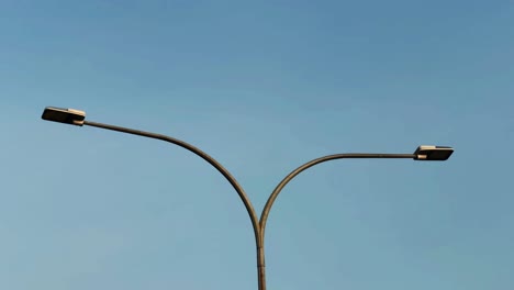 a single y shape led street light during blue sky