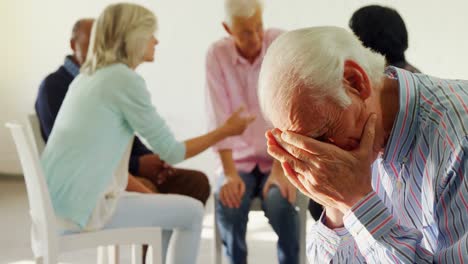 Senior-man-sitting-at-health-center-4k