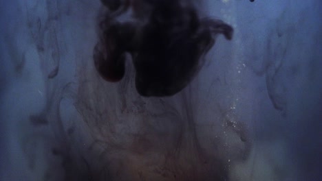 paint floating in water looking like majestic nebulas. stable shot with the sony a7iii