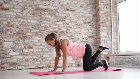 woman performing leg lifts exercise